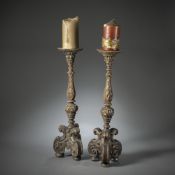 A PAIR OF WOODCARVED ALTAR CANDLESTICKS