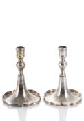 A PAIR OF SILVER CANDLESTICKS