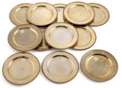 A SET OF TWELFE VERMEIL DINNER PLATES