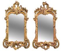 A PAIR OF GERMAN CARVED GILTWOOD MIRRORS