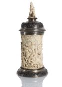 A LARGE SILVER MOUNTED IVORY TANKARD WITH MYTHOLOGICAL SCENES