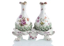 A RARE FLORAL PATTERN ROCOCO CRUET STAND WITH TWO BOTTLES