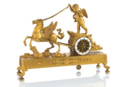 A FRENCH ORMOLU PENDULE WITH CHARIOT AN PUTTO