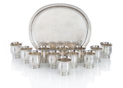 A SET OF 12 SILVER BEAKER AND A TRAY