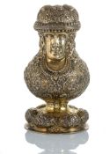 A DECORATIVE VERMEIL JARD WITH GRIMACING FACE