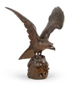 A SWISS CARVED WALNUT EAGLE