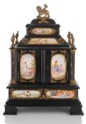 AN AUSTRIAN EBONIZED WOOD CABINET  WITH GILT METAL MOUNTED ENAMELLED PLAQUES