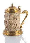 A GILT COPPER MOUNTED IVORY TANKARD
