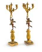 A PAIR OF CHARLES X GILT AND PATINATED BRONZE THREE LIGHT GIRANDOLES
