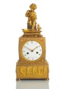 A FINE ORMOLU EMPIRE PENDULE WITH PUTTO