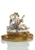 A MEISSEN PUTTO WITH LEOPARD
