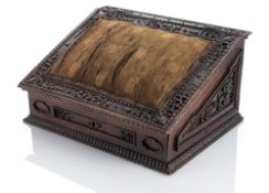 A SOUTH GERMAN CARVED WALNUT SEWING CASKET