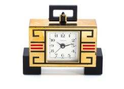 A SMALL CARTIER GILT BRASS AND ENAMEL TABLE CLOCK