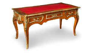 A LOUIS XV STYLE GILT BRASS MOUNTED TULIPWOOD BUREAU PLAT