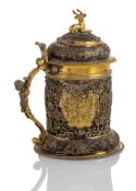 A CONTINENTAL BAROQUE PARCEL GILT SILVER TANKARD