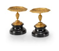 A PAIR OF FRENCH GILT BRONZE AND BLACK MARBLE TAZZE