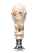 A FINELY CARVED IVORY AND SILVER SEAL
