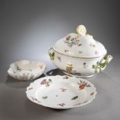 A PORCELAIN TUREEN AND COVER; A SHELL BOWL AND A ROUND DISH