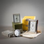 FOUR PARTIAL PLATED TABLE CLOCKS AND A THERMO-HYGROMETER