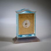 A SWISS SILVER AND ENAMEL TABLE CLOCK