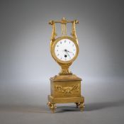 A NEOCLASSICAL LYRA SHAPED BRONZE TABLE CLOCK