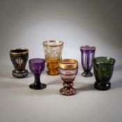 FIVE GLASS BEAKER AND A WINE GLASS