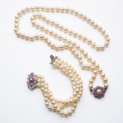 A CULTURED PEARL NECKLACE AND A BRACELET