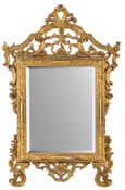 A CARVED AND GILTWOOD MIRROR