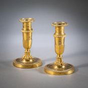A PAIR OF NEOCLASSICAL GILT BRONZE CANDLESTICKS