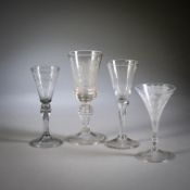 A BAROQUE GLASS GOBLET WITH PRINCELY COAT OF ARMS, THREE WINE GLASSES