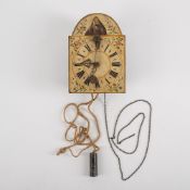 A SOUTH GERMAN IRON WALL CLOCK