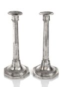 A PAIR OF SILVER CANDLESTICKS