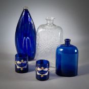 A NAVEL BOTTLE, TWO RECTANGULAR BOTTLES AND TWO CUPS