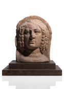 A TERRACOTTA BUST OF AN ANTIQUE WOMAN