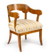 A GERMAN WALNUT BIEDERMEIER ARM CHAIR