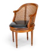 A FRENCH BEECHWOOD DESK CHAIR