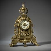 A LARGE BRASS PENDULE