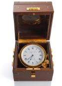 A MARITIME SHIP'S CLOCK IN THE STYLE OF THE CHRONOMETERS
