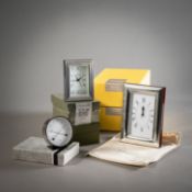 FOUR PARTIAL PLATED TABLE CLOCKS AND A THERMO-HYGROMETER