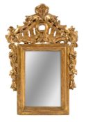 A SMALL CARVED AND GILTWOOD MIRROR