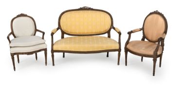 A LOUIS XVI CARVED WALNUT SOFA AND TWO FAUTEUILS