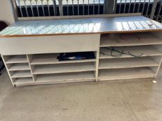 large wooden work bench (partial glass top)