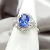 18ct White Gold Oval Tanzanite & Diamond Cluster Ring