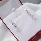 Diamond & White Gold Infinity-Style Drop Earrings