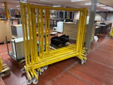 14 Yellow Wheeled Clothing Rails