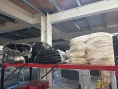 Shelf Of White And Black Plastic Wire Protectors