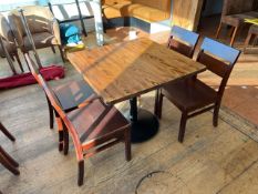Brown Wooden Table With Metal Base And Four Wooden Chairs