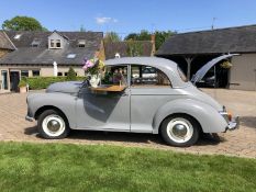 A stunning 1965 Bar-Converted Grey Morris Minor that transforms any event into a celebration of