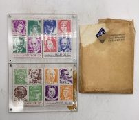 Two Skelly Commemorative Stamp Paperweights