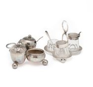 TWO VICTORIAN SILVER THREE-PIECE CRUET STANDS IN THE MANNER OF CHRISTOPHER DRESSER